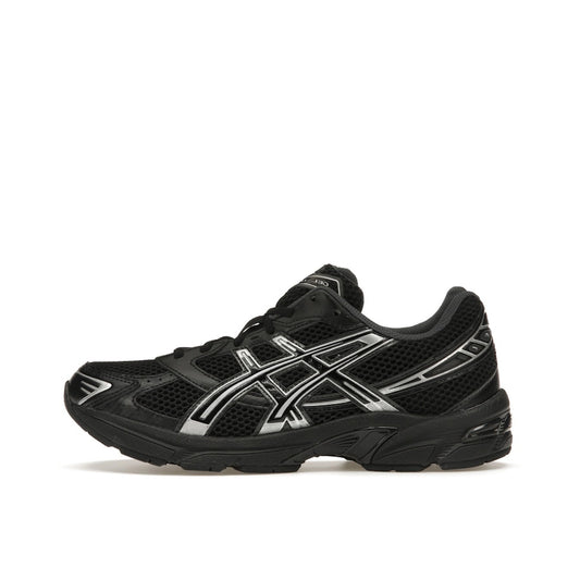 ASICS Gel-1130, side view, in black with silver tones and GEL cushioning technology.