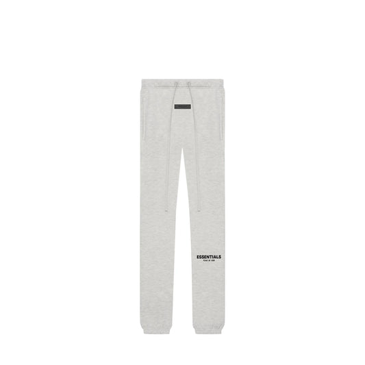 Fear of God Essentials Sweatpants, front view, in Light Oatmeal with tonal logo print.