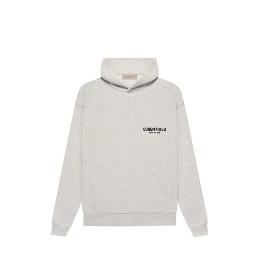 Fear of God Essentials Hoodie, side view, in Light Oatmeal with tonal chest logo.