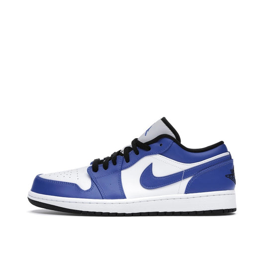 Jordan 1 Low Game Royal sneakers, side view, in blue and white with black overlays.