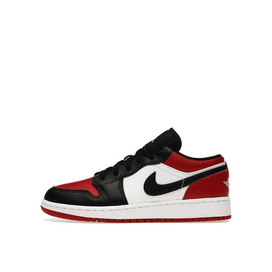Jordan 1 Low GS sneakers, side view, in black, red, and white bred toe colorway.