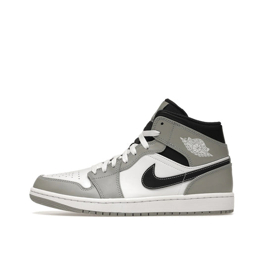 Jordan 1 Mid sneakers, side view, model 554724-078 in smoke grey with anthracite details.