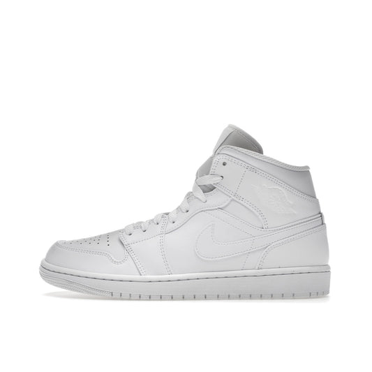 Air Jordan 1 Mid, side view, classic silhouette in full triple white colorway.