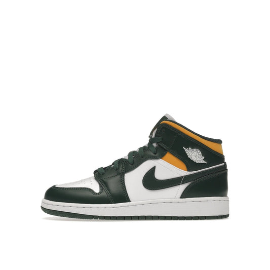 Jordan 1 Mid GS sneakers, side view, in green with yellow accents and white base.