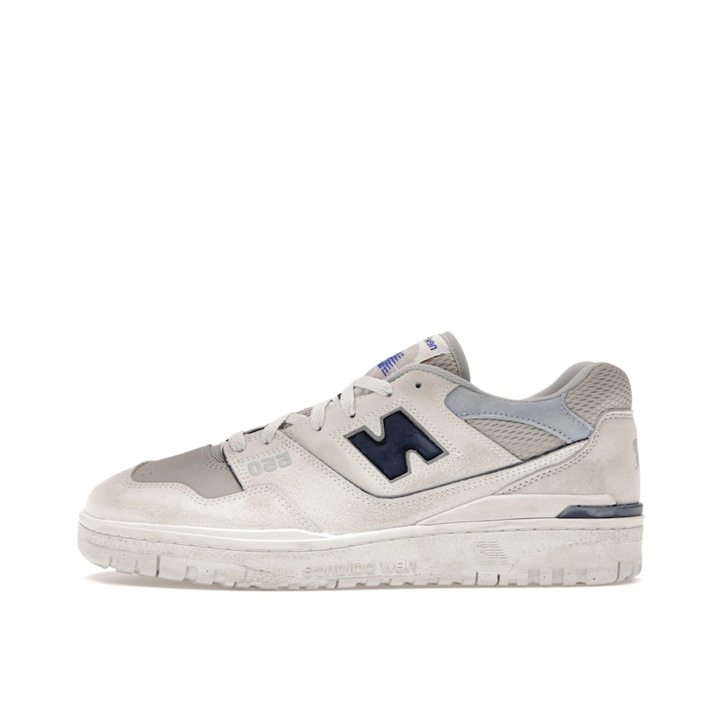New Balance 550 sneakers, side view, model BB550GD1 in grey with white details.