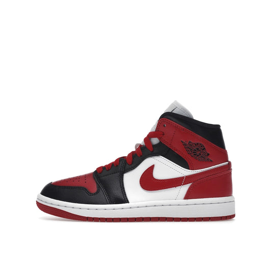 Air Jordan 1 Mid Women’s sneakers, side view, in alternate bred toe colorway with red, black, and white.