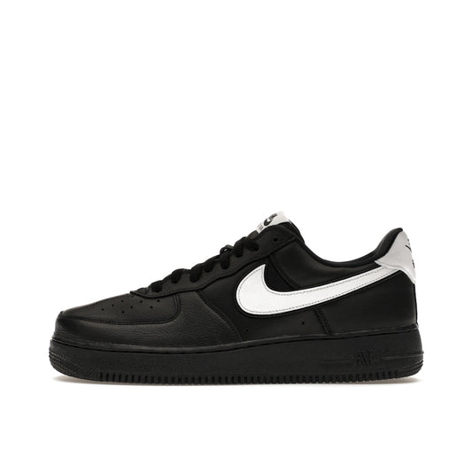 Nike Air Force 1 Low QS sneakers, side view, model CQ0492-001 in black with white details.