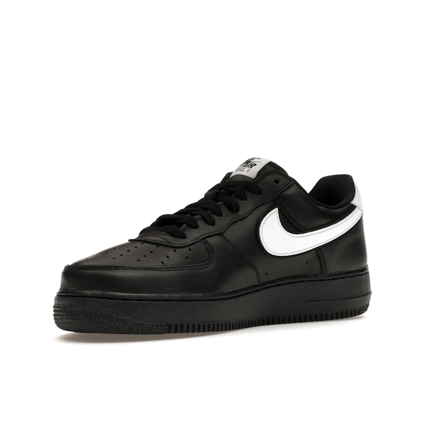 Nike Air Force 1 Low QS sneakers, front view, model CQ0492-001 in black with white details.