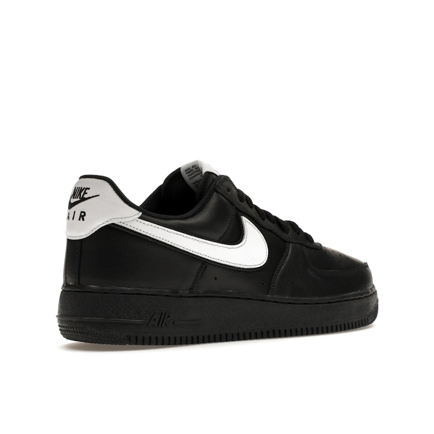 Nike Air Force 1 Low QS sneakers, back view, model CQ0492-001 in black with white details.