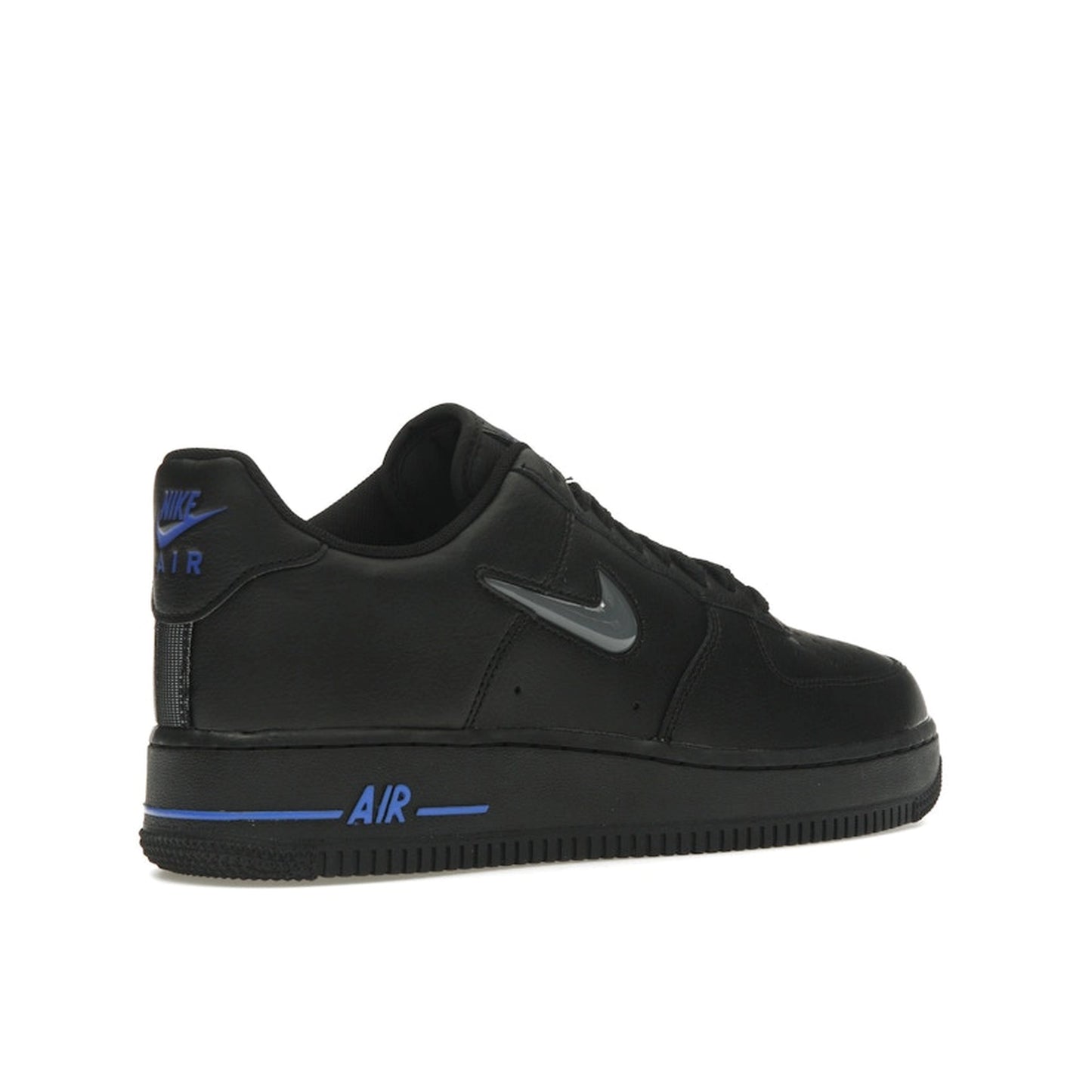 Nike Air Force 1 Low sneakers, back view, in black with jewel swoosh in grey and royal blue.