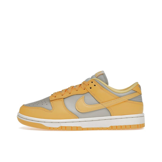 Nike Dunk Low sneakers, side view, model DD1503-002, in Citron Pulse, grey and yellow, women's.
