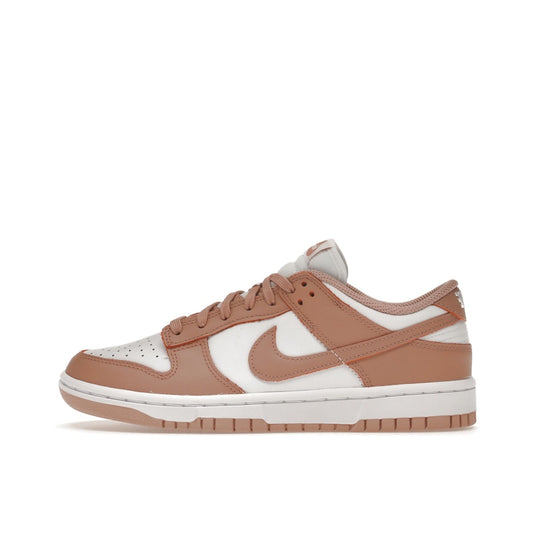 Nike Dunk Low Rose Whisper Women’s sneakers, side view, in white with soft pink overlays.