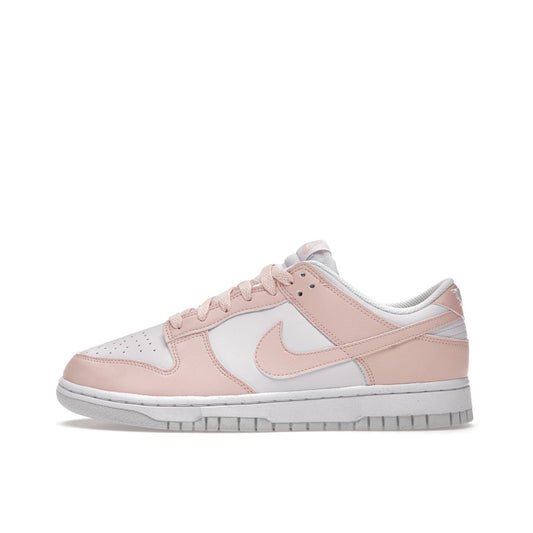 Nike Dunk Low Next Nature Women’s sneakers, side view, in pale coral and white.