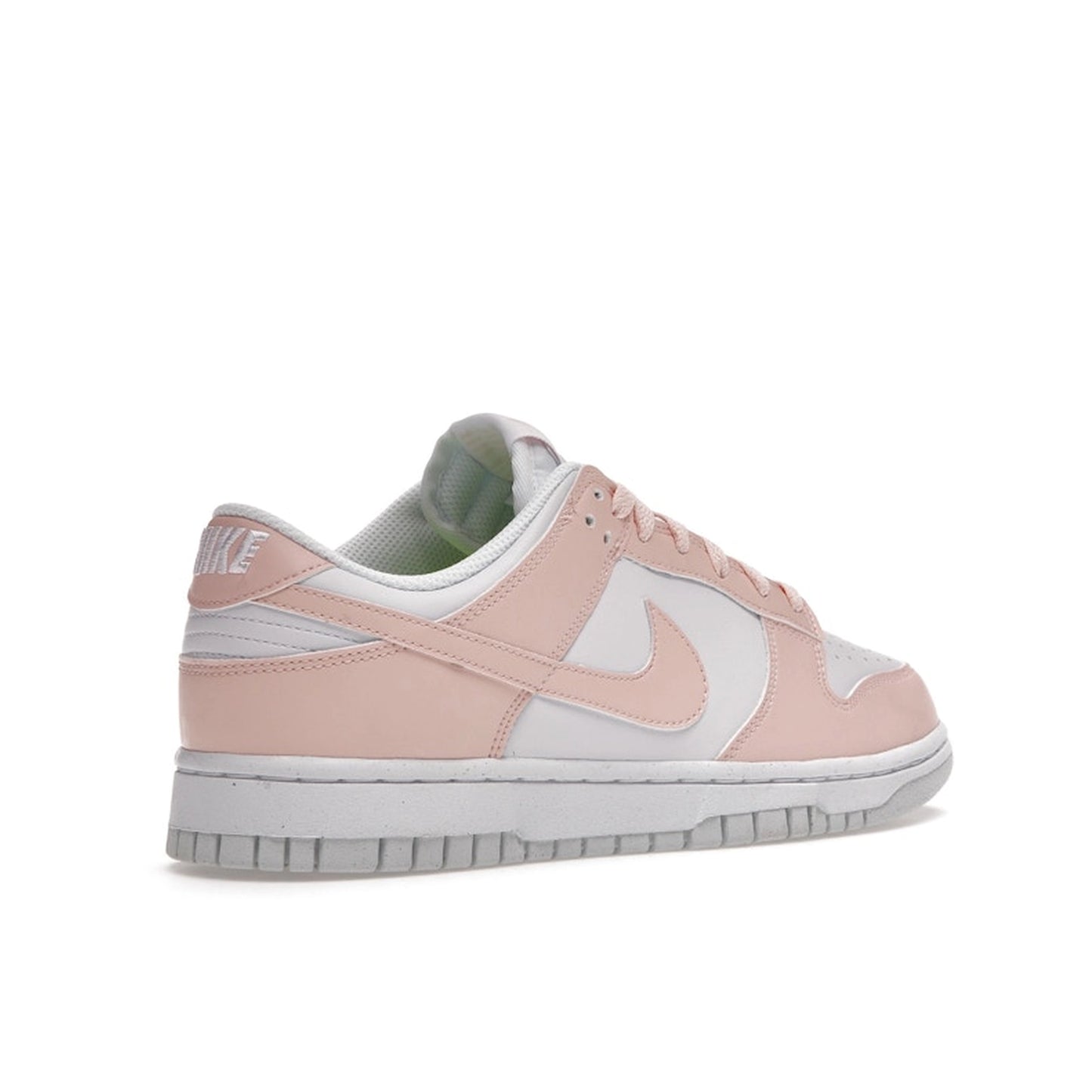 Nike Dunk Low Next Nature Women’s sneakers, back view, in pale coral and white.