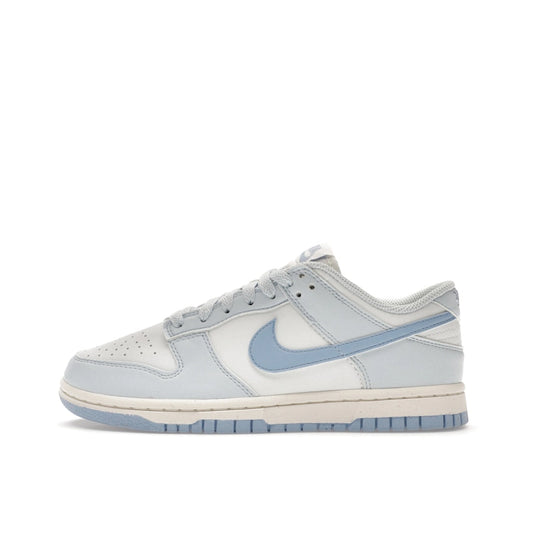 Nike Dunk Low Next Nature Women's sneakers, side view, model DD1873-400, in blue tint with a sleek finish.