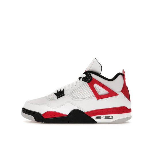 Air Jordan 4 Retro Red Cement sneakers, side view, model DH6927-161, featuring a white base with red and black highlights.