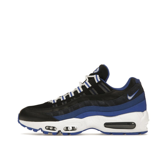 Nike Air Max 95 sneakers, side view, in black with team royal blue details.