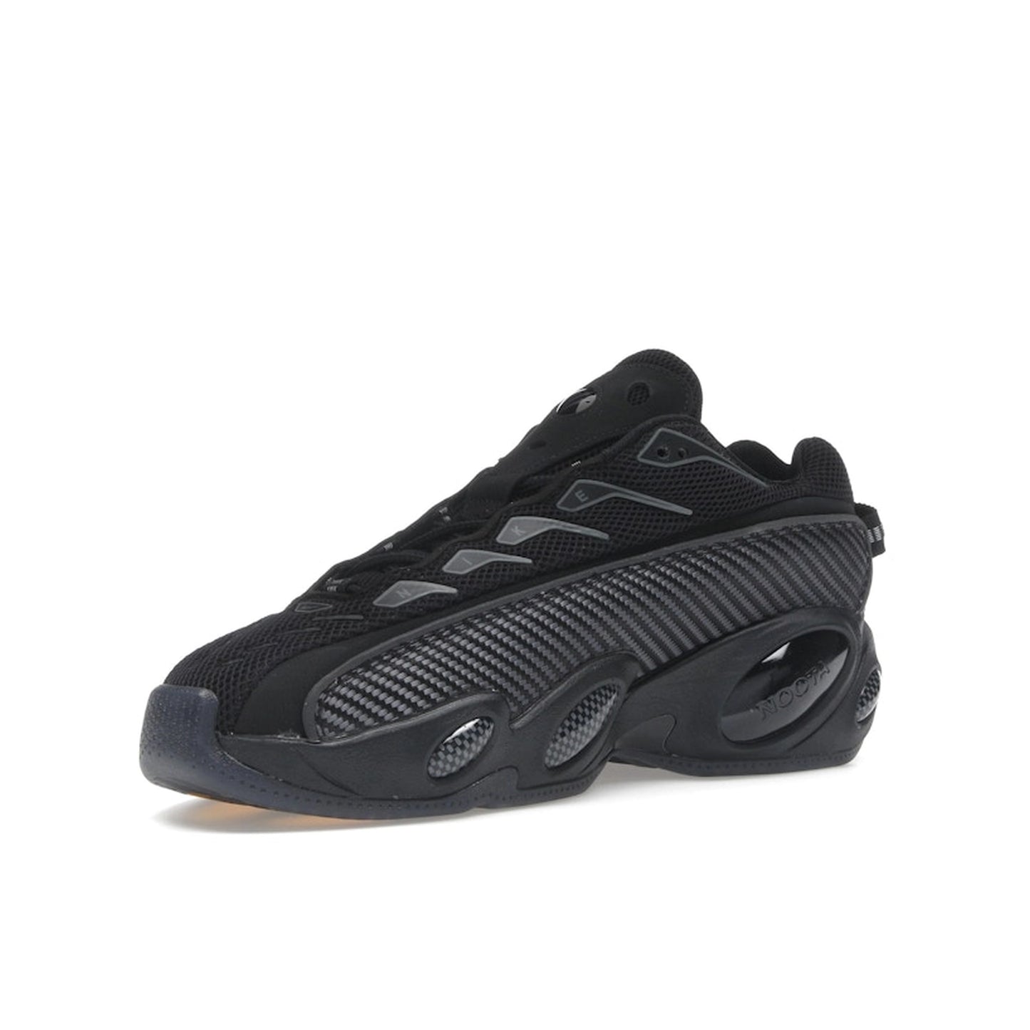 Nike NOCTA Glide Black Iron Grey, side view, athletic silhouette with signature NOCTA styling.