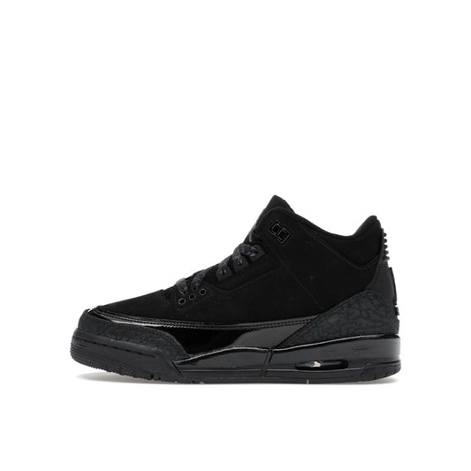 Jordan 3 Retro sneakers, side view, in black with tonal branding and classic midsole.
