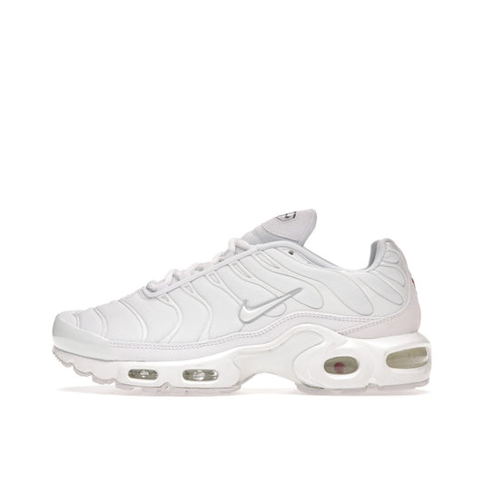 Nike Air Max Plus sneakers, side view, in all-white triple white colorway.
