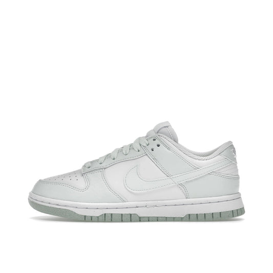 Nike Dunk Low Next Nature Women's sneakers, side view, model DN1431-102 in white with mint green details.