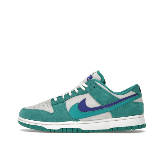Nike Dunk Low SE '85 Women's sneakers, side view, model DO9457-101 in Neptune green with white and grey details.