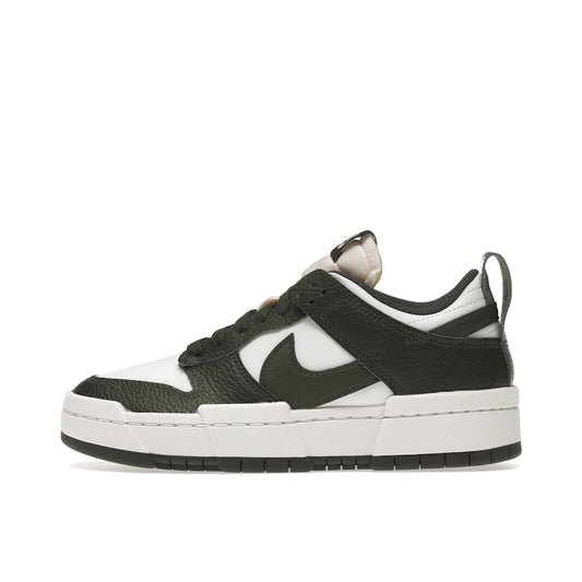 Nike Dunk Low Disrupt, side view, in forest green overlays with clean white leather panels.