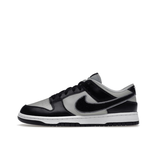 Nike Dunk Low Chenille Swoosh sneakers, side view, model DQ7683-001 in black and grey.