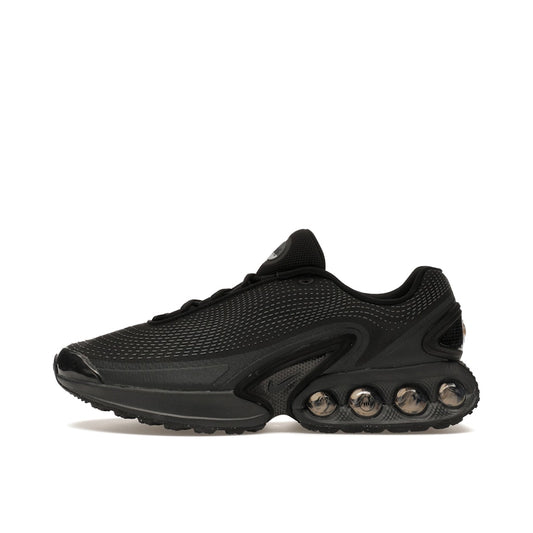 Nike Air Max DN sneakers, side view, model DV3337-002 in black with dark smoke grey details.