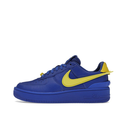 Nike Air Force 1 Low SP Ambush sneakers, side view, model DV3464-400, in game royal with yellow swoosh.