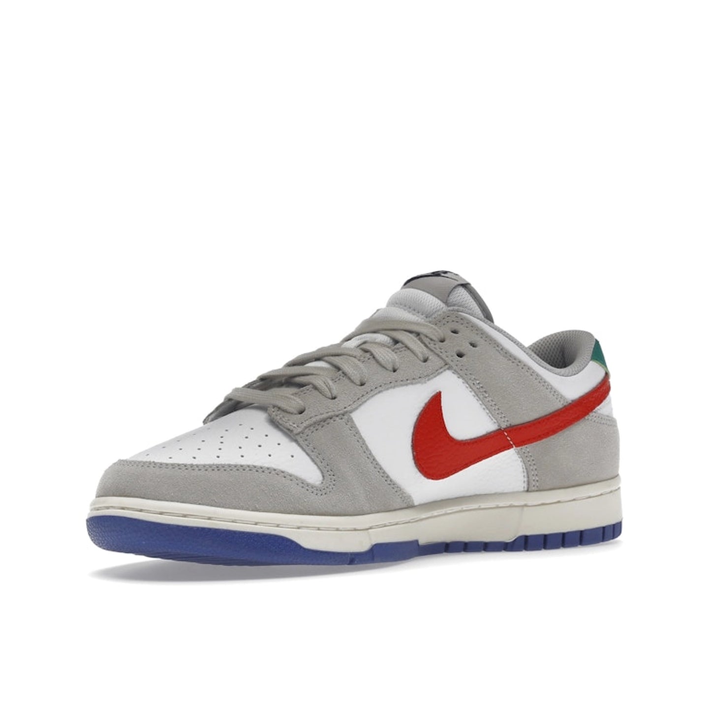 Nike Dunk Low sneakers, front view, model DV3497-001 in light iron ore with red and blue details.
