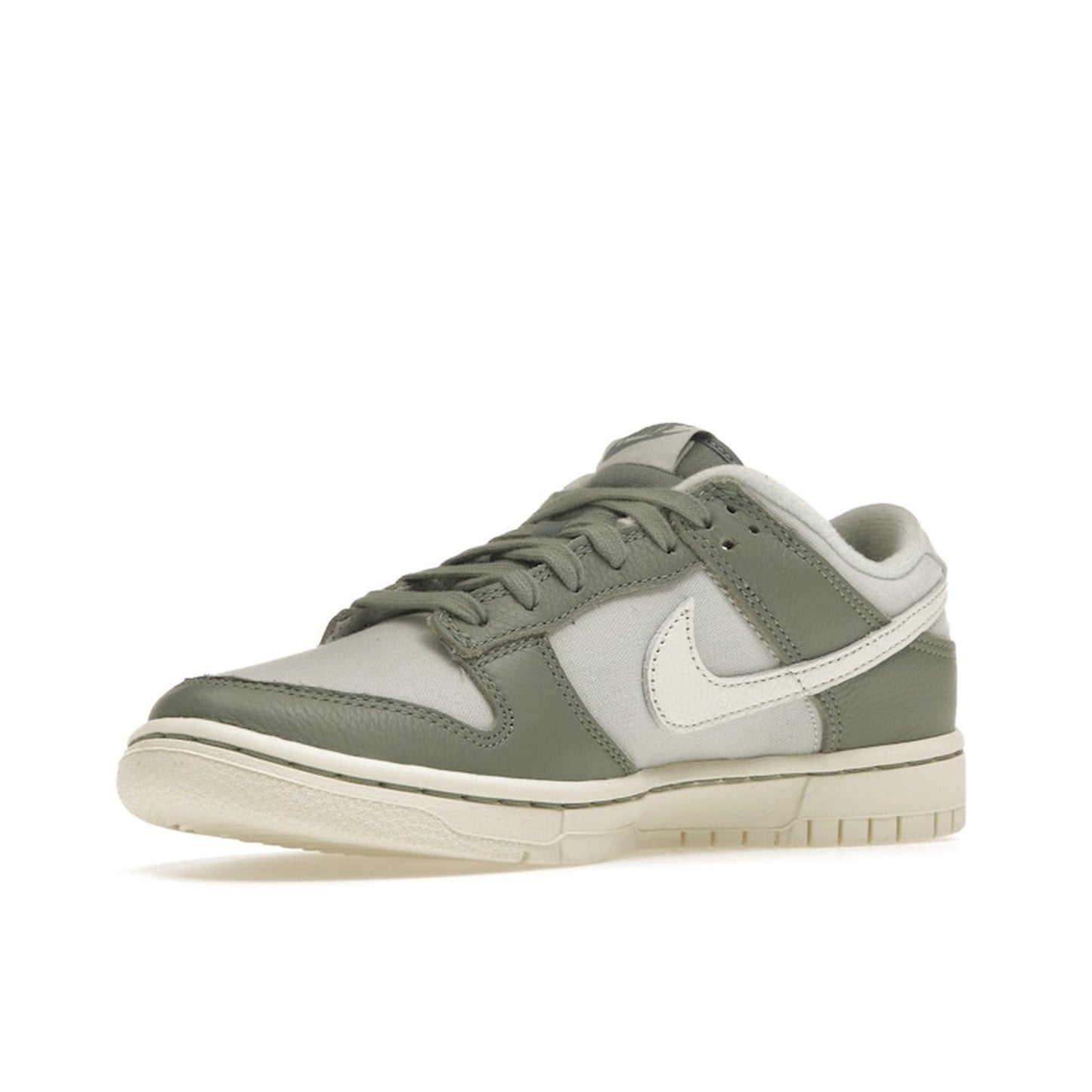 Nike Dunk Low sneakers, front view, model DV7212-300 in mica green with white and grey details.
