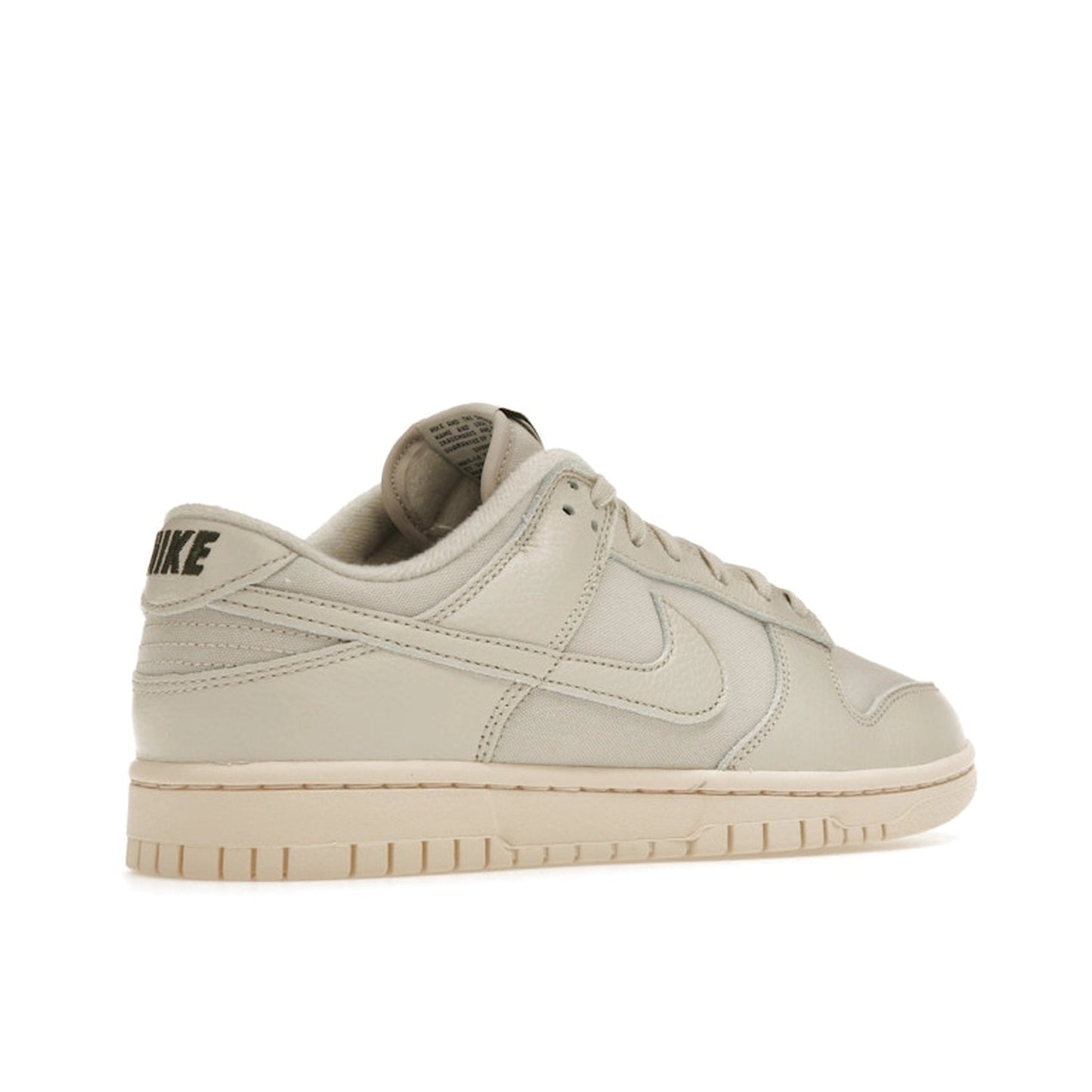 Nike Dunk Low Premium sneakers, back view, model DZ2538-100, in light orewood brown with white and beige accents.