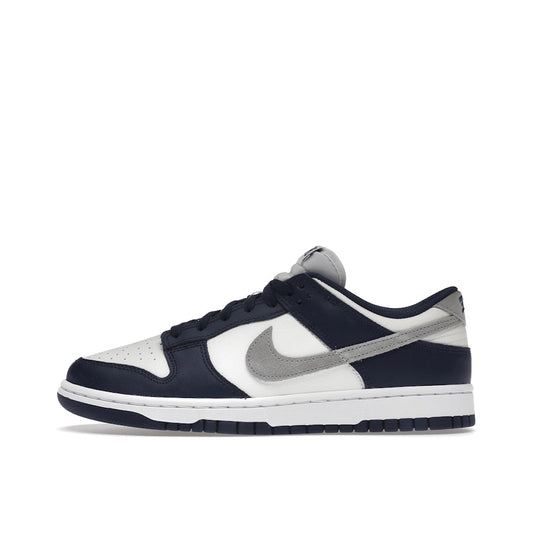 Nike Dunk Low Summit White Midnight Navy sneakers, side view, model FD9749-400 in white with navy accents.