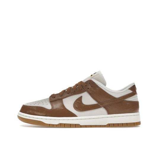 Nike Dunk Low LX Ale Brown Ostrich, side view, in dark brown with embossed leather details.