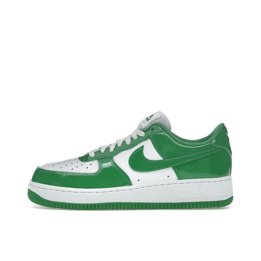 Nike Air Force 1 Low ’07 Kelly Green Patent, side view, glossy green overlays on white leather base.