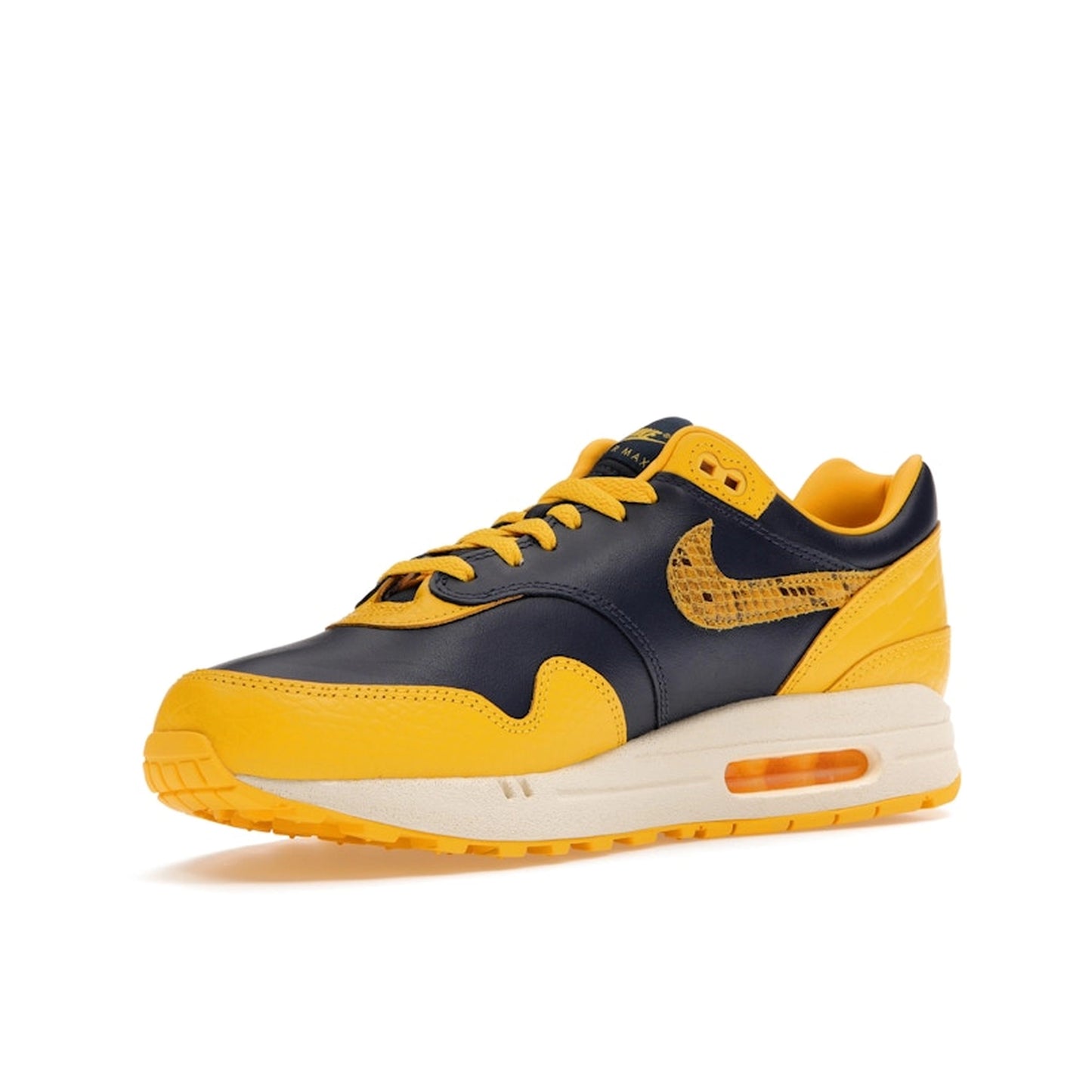 Nike Air Max 1 CO.JP Michigan Women’s sneakers, front view, in navy blue and maize yellow.