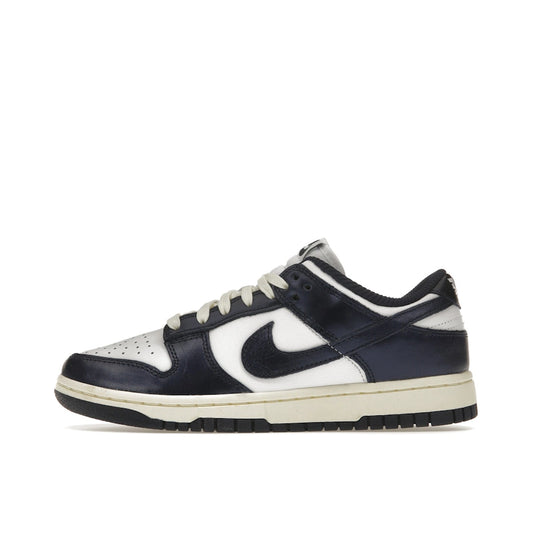 Nike Dunk Low PRM Women's sneakers, side view, model FN7197-100, in vintage navy with white accents.