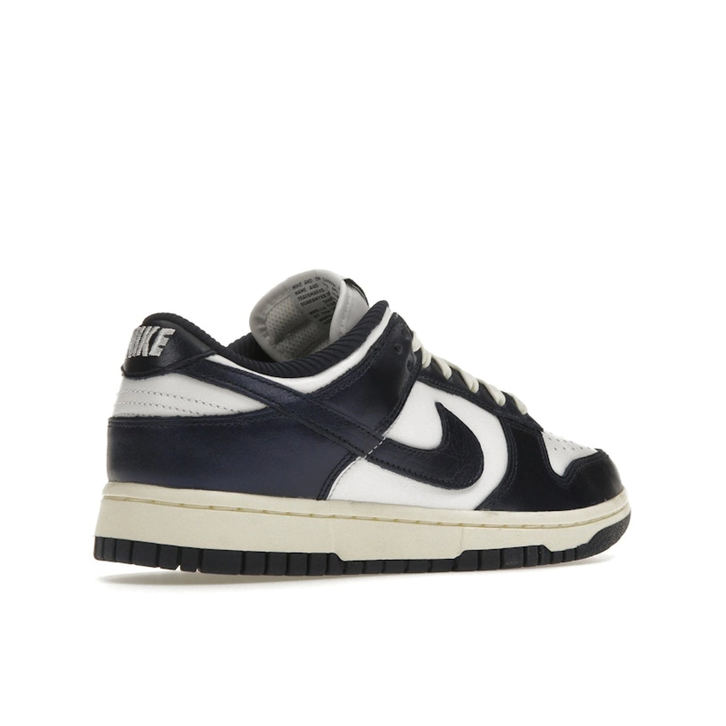 Nike Dunk Low PRM Women's sneakers, back view, model FN7197-100, in vintage navy with white accents.
