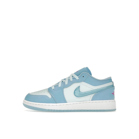 Jordan 1 Low SE sneakers (GS), side view, model FN7366-400, in Aquarius Blue with white details.