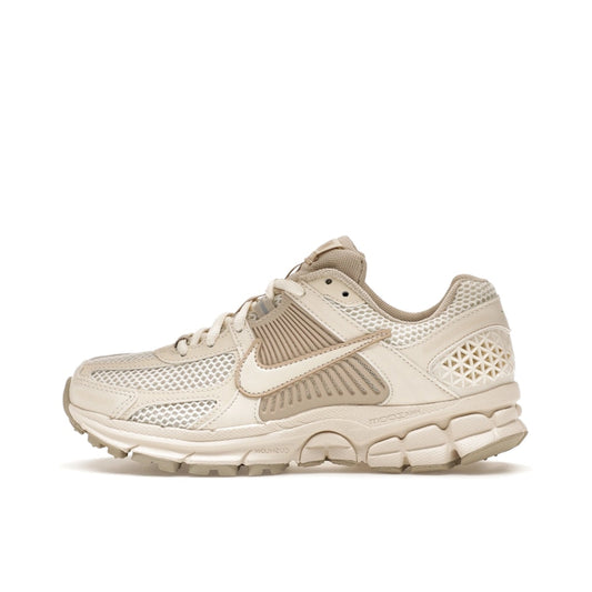 Nike Zoom Vomero 5 Sail Light Orewood Brown, side view, in cream tones with layered textures.