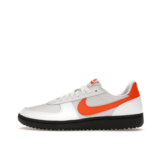 Nike Field General ’82, side view, in white leather with orange blaze swoosh and details.