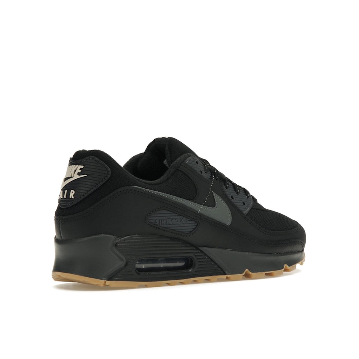 Nike Air Max 90, back view, in black and grey with reflective details and gum outsole.