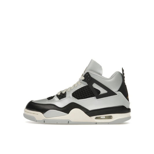 Jordan 4 Retro Platinum Gold (GS), side view, in matte grey with metallic gold accents.