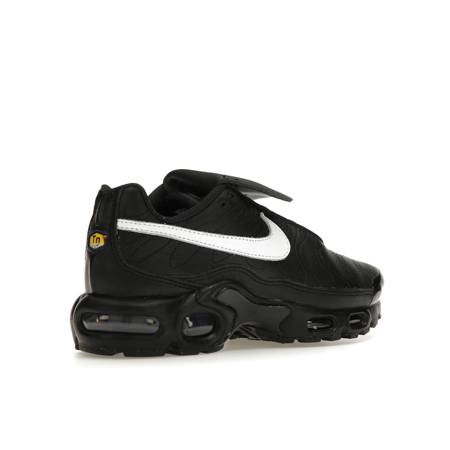 Nike Air Max Plus Tiempo, back view, in black leather with white swoosh and sole.