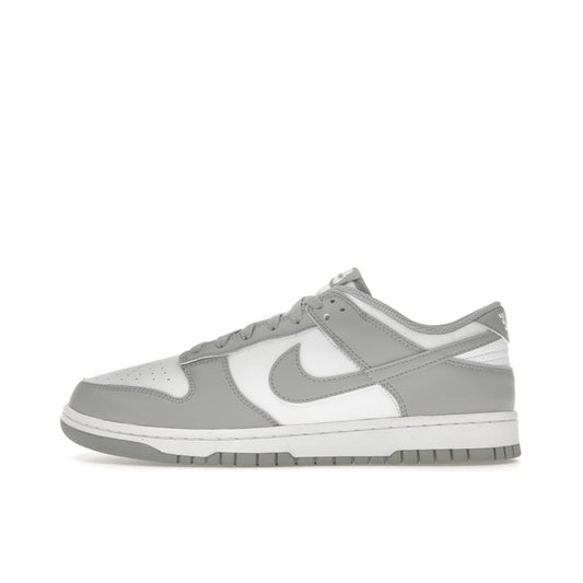 Dunk Low Light Smoke Grey, side view, minimalist two-tone white and grey colorway.