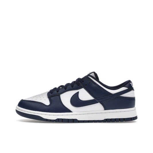 Nike Dunk Low White Midnight Navy, side view, clean white leather with dark blue overlays.