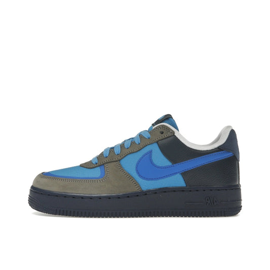 Nike Air Force 1 Low SP Stash (2024) side view – black and blue upper with leather, suede and mesh mix, bold blue swoosh and dark sole