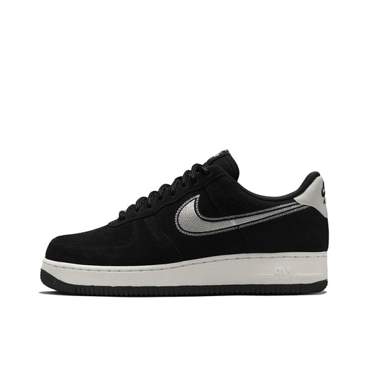Nike Air Force 1 ’07 LV8, side view, in black upper with embroidered sail white Swoosh.