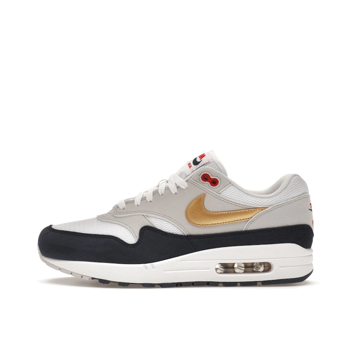Nike Air Max 1 sneakers, side view, in blue, red, and white Olympic-inspired colors.
